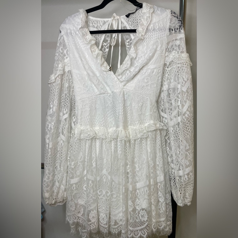White lace mini dress with back cutout